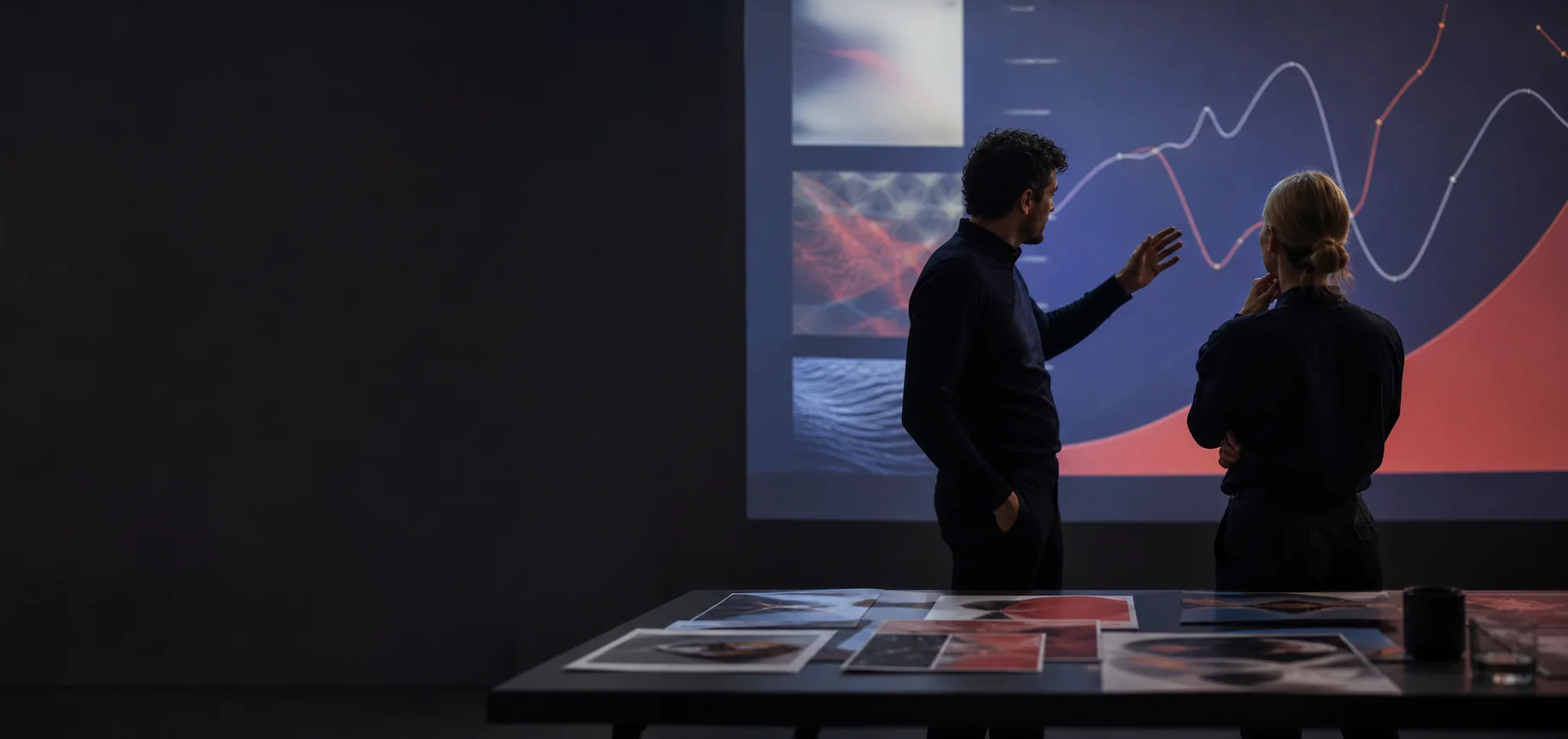 Marketing strategists reviewing an abstract campaign projection
